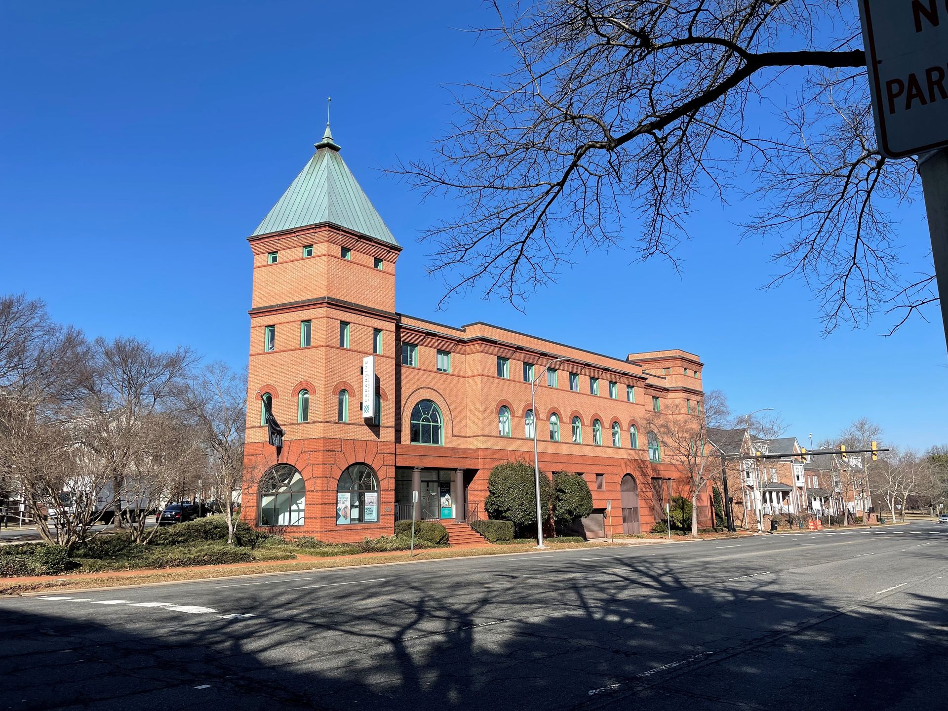 A large brick building with a tower on top of it