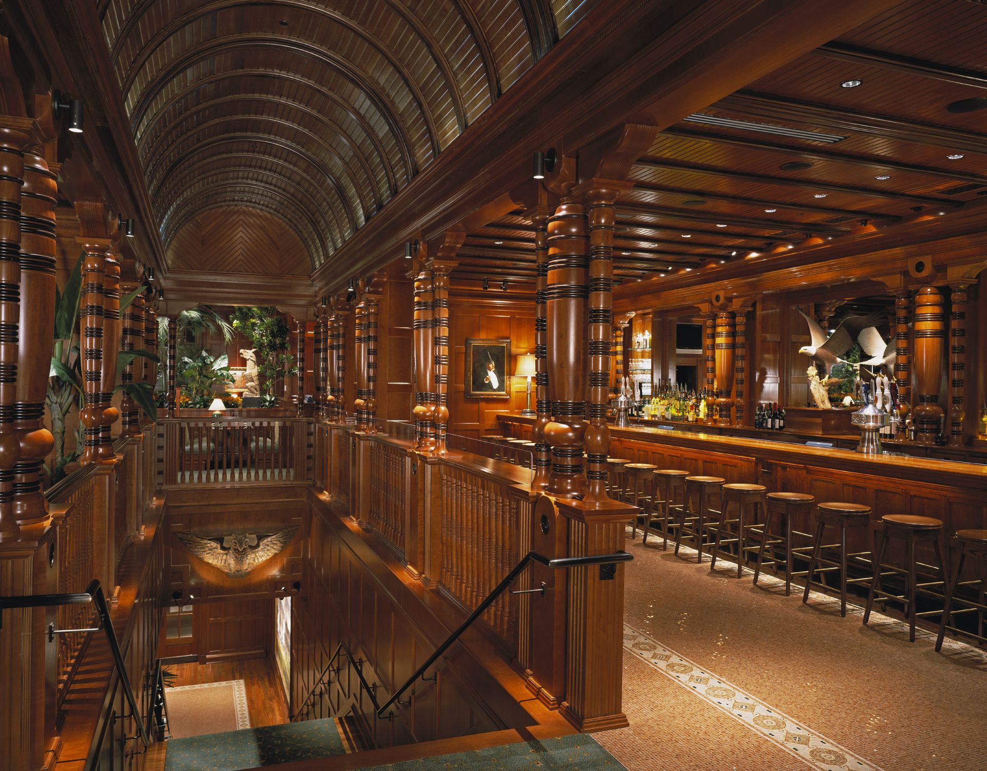A large wooden building with a bar and stairs