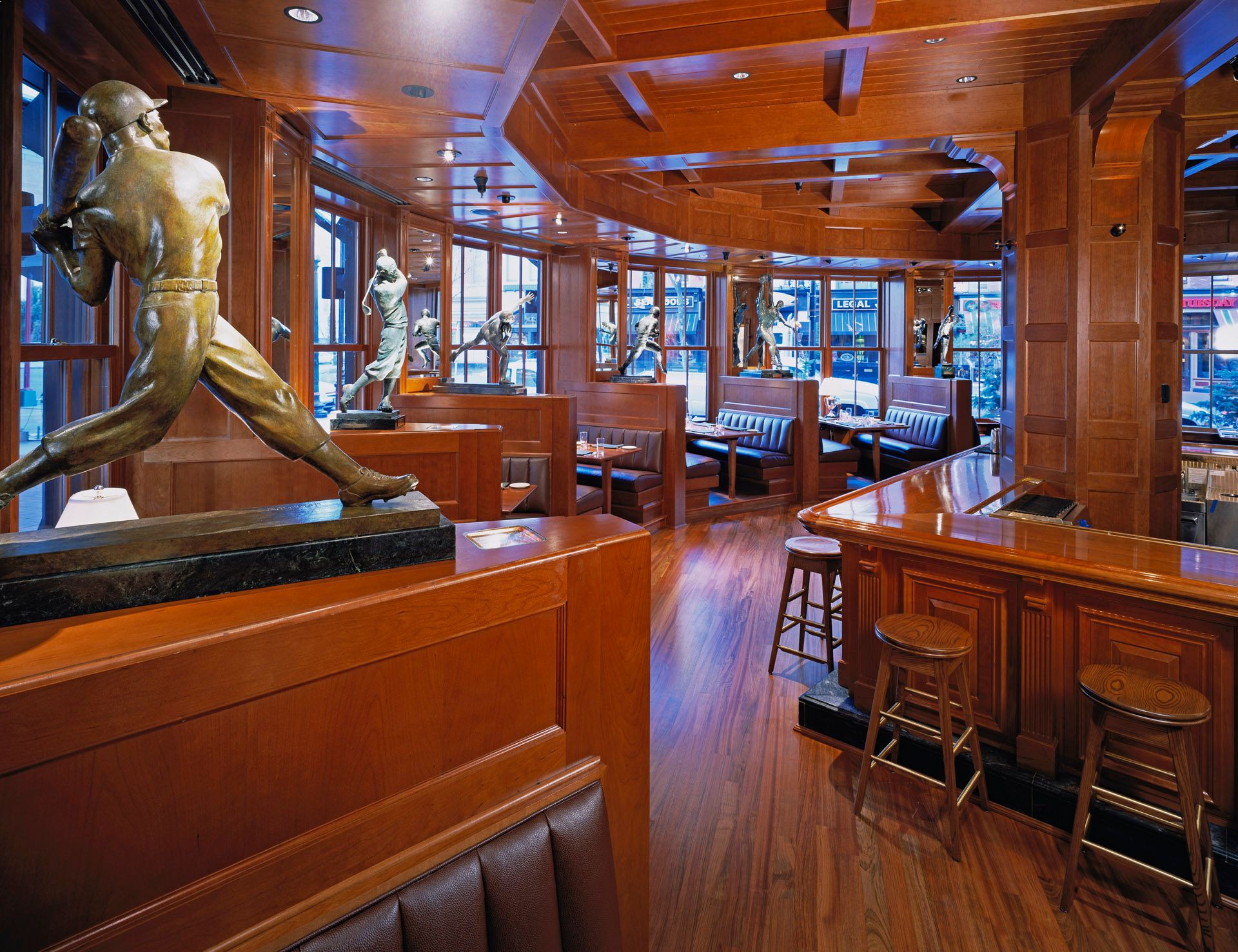 A statue of a baseball player in a restaurant