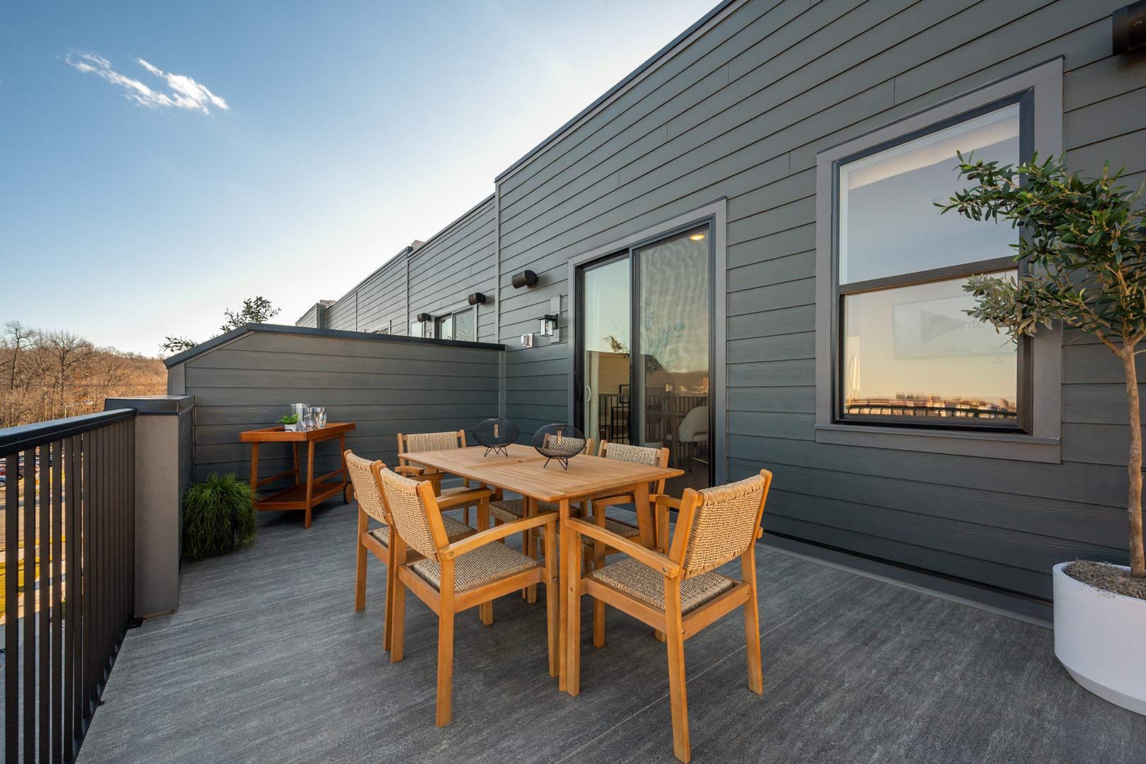 There is a patio with a table and chairs on it.