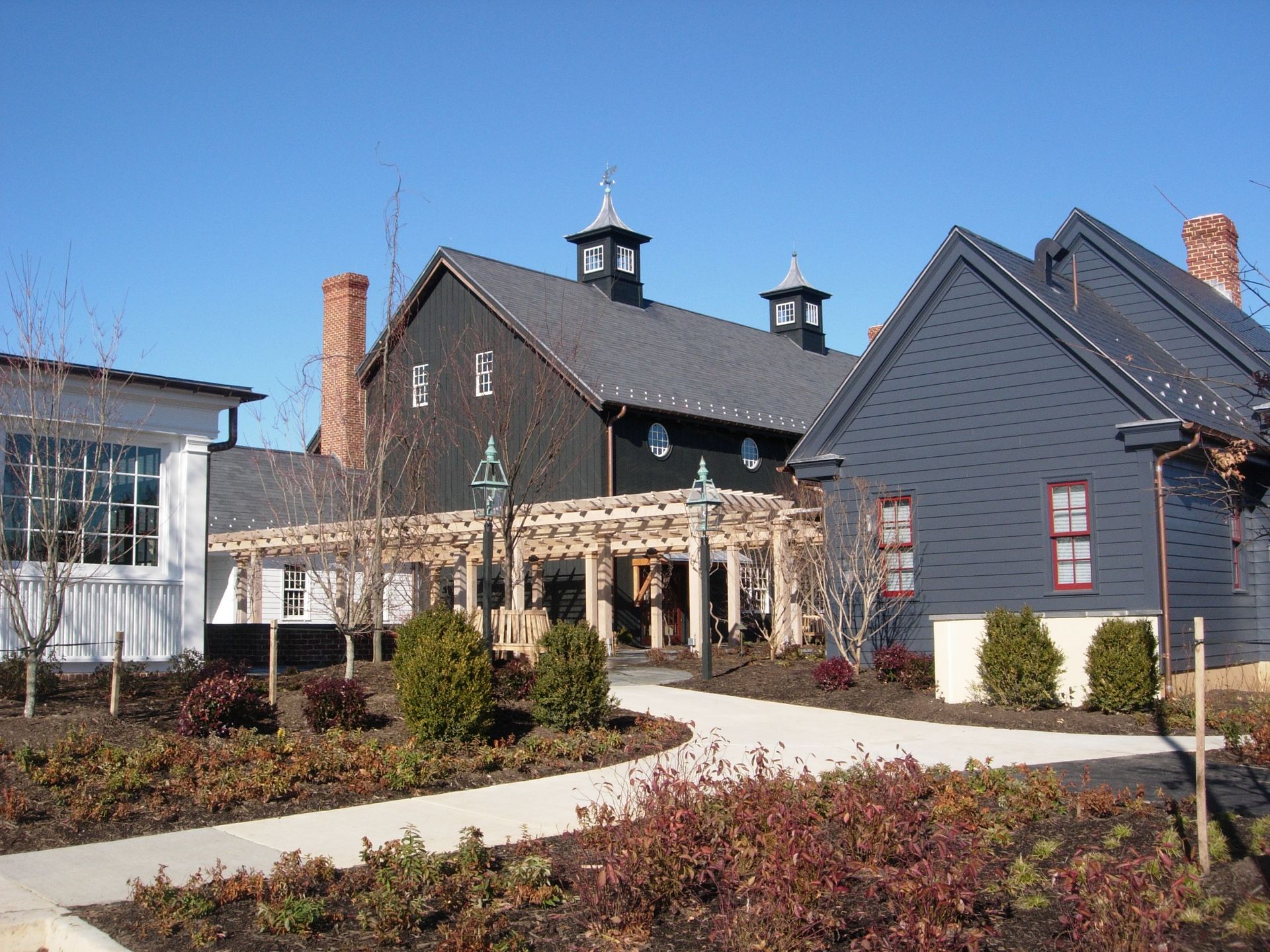 A black building with a chimney on top of it