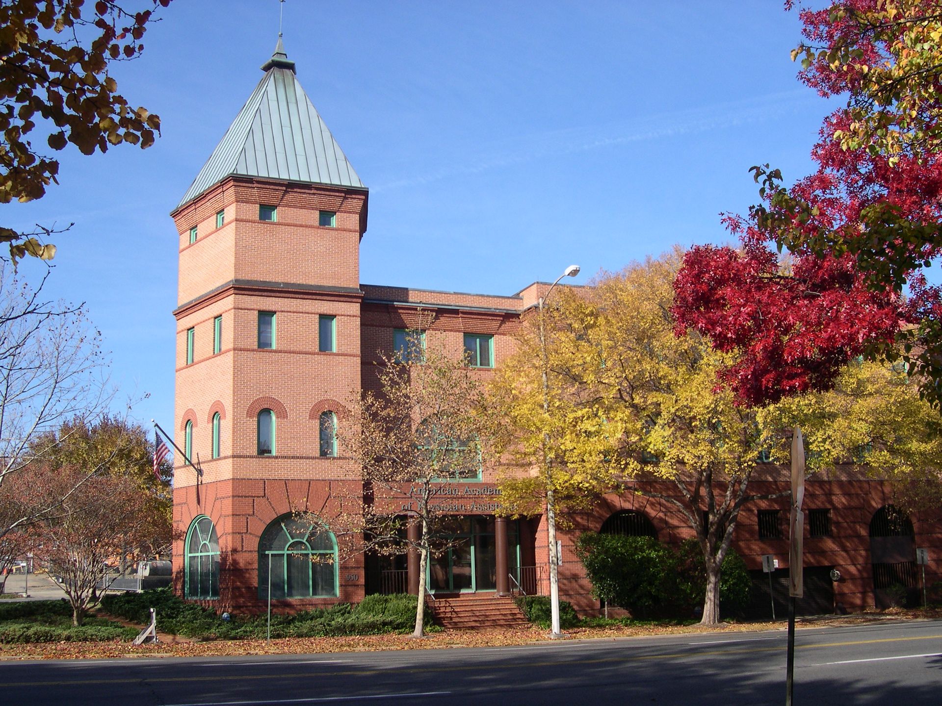 A large brick building with a tower on top of it