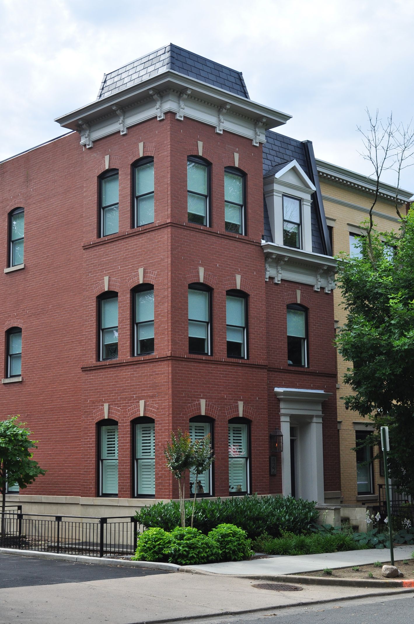 A large red brick building with many windows