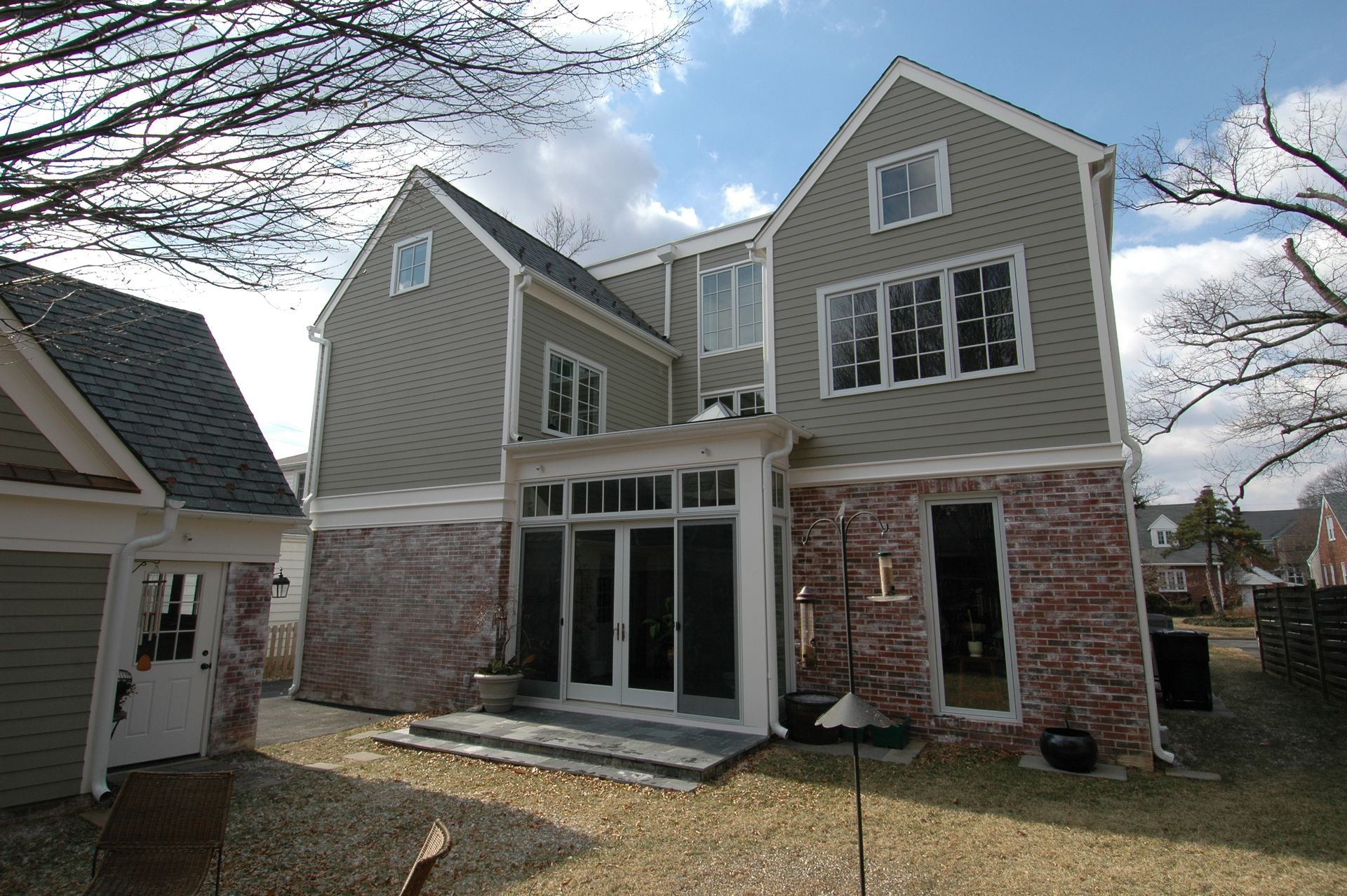 A large house with a lot of windows and doors