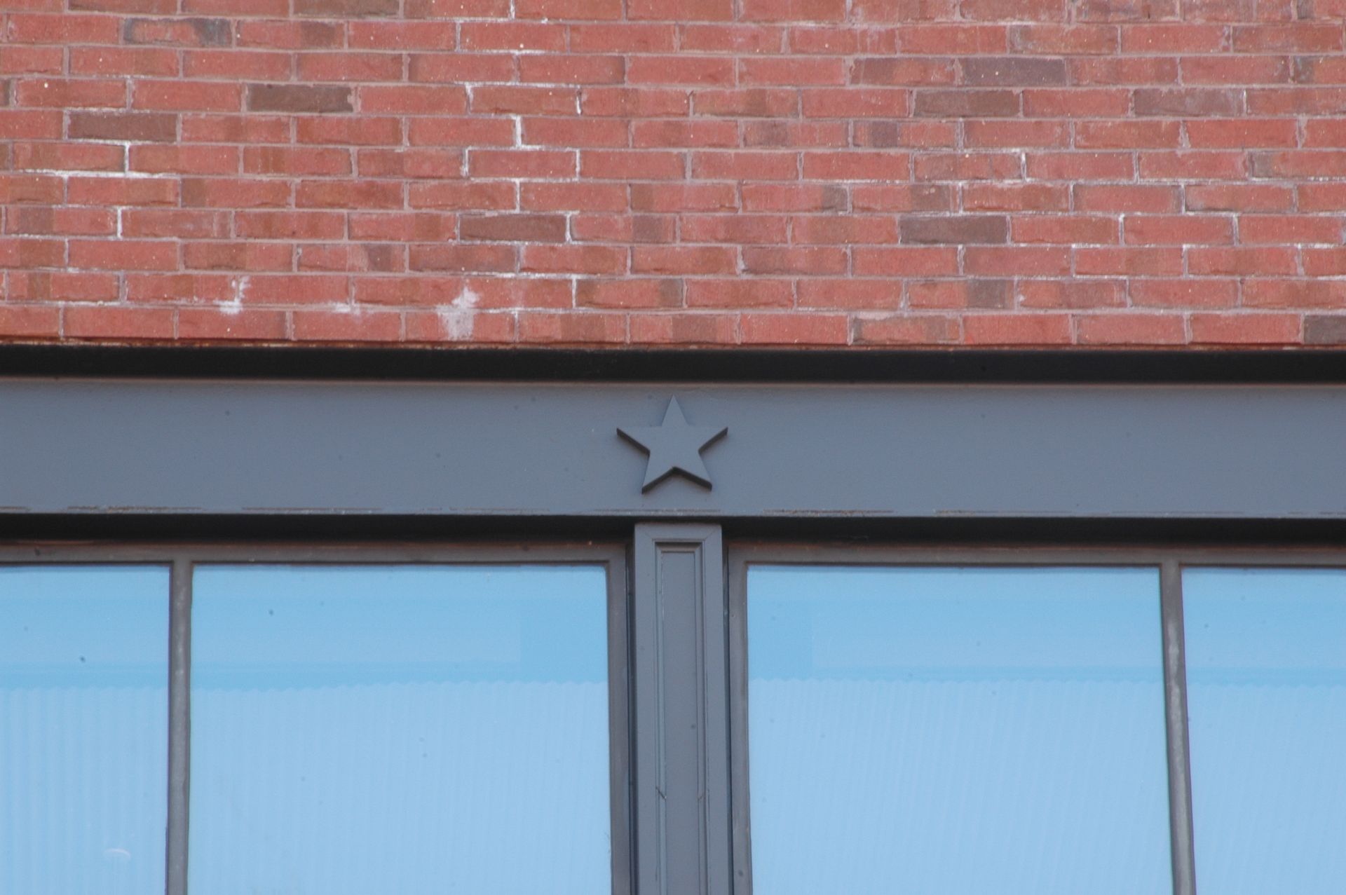 A brick building with a star on the top of it