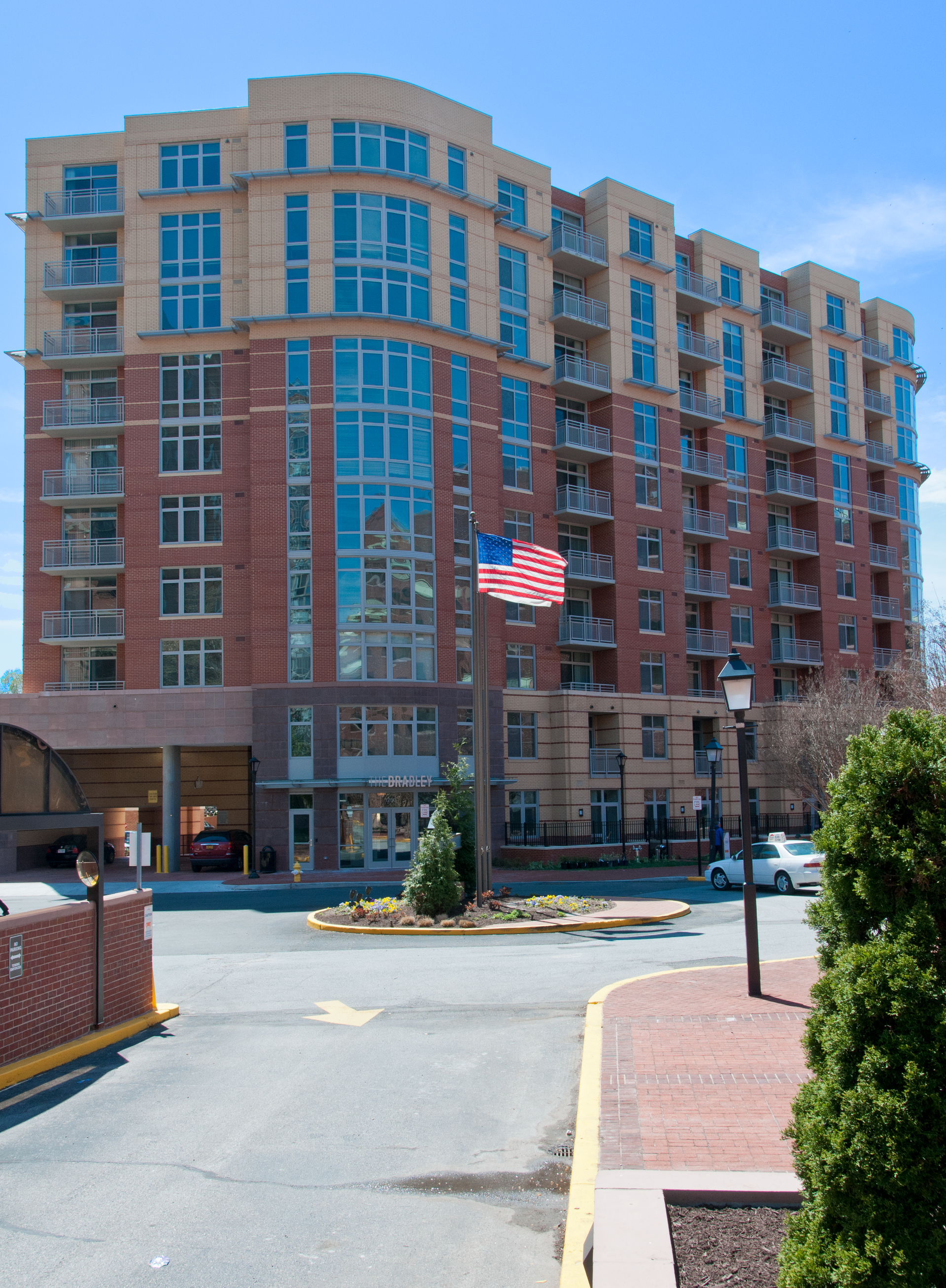 A large building with an american flag in front of it