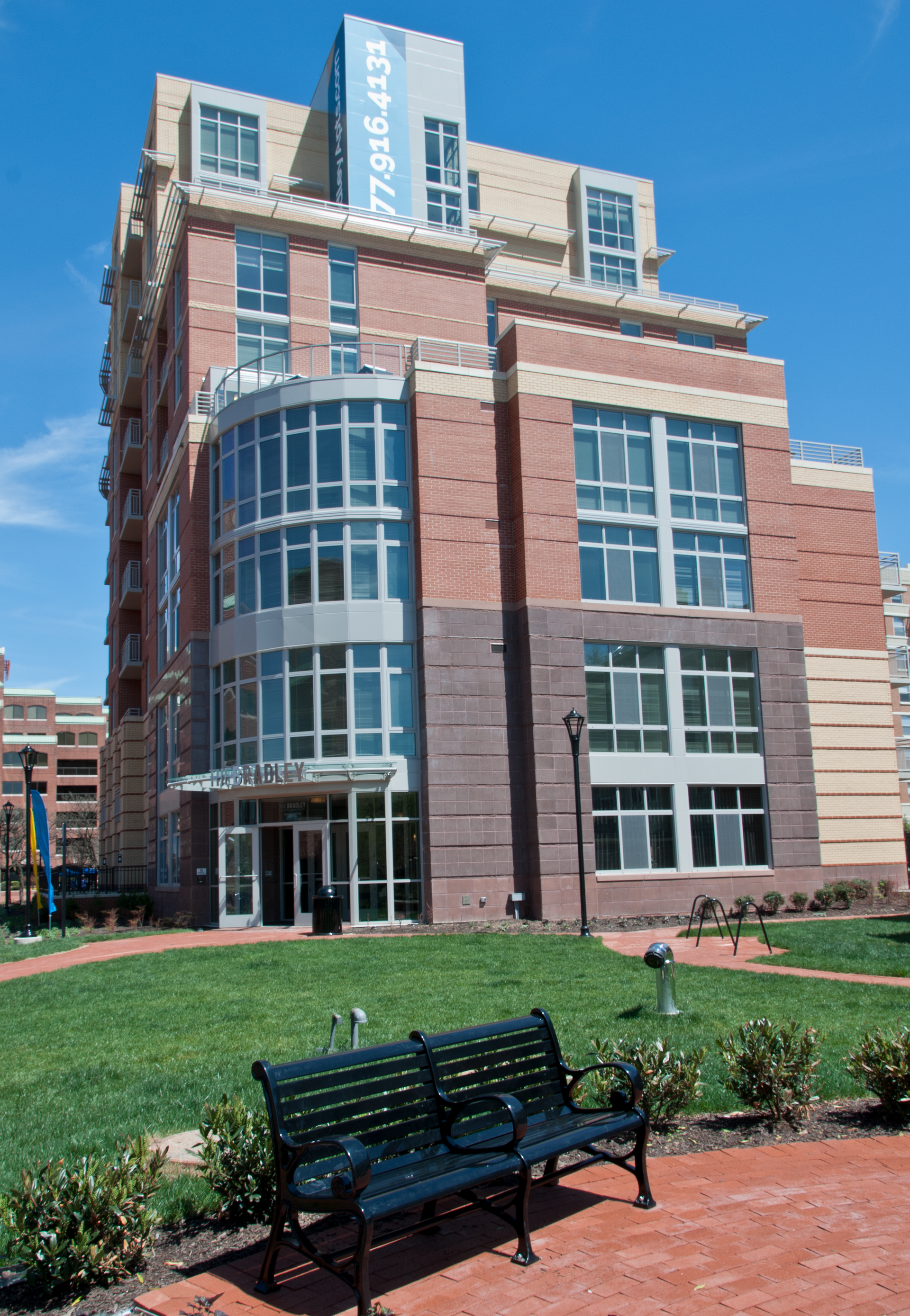 A large brick building with a sign on the top that says ' liberty square '