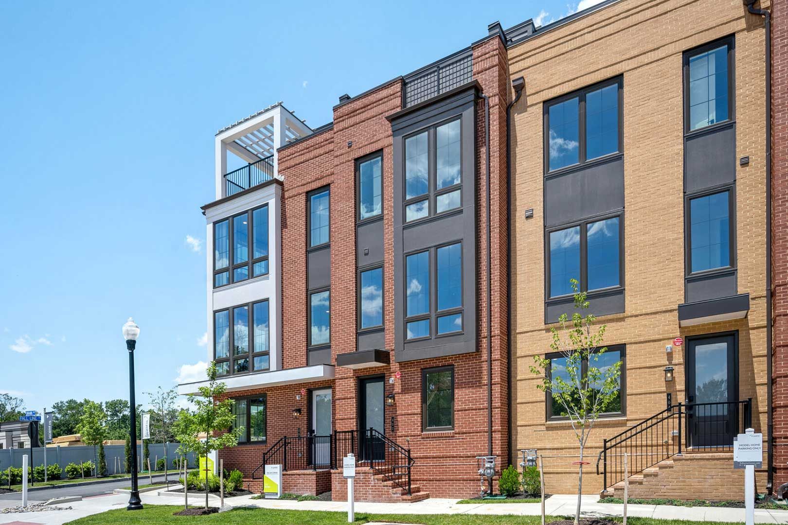 A brick building with a lot of windows and stairs.
