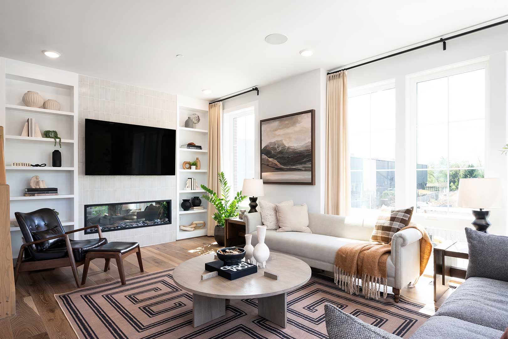 A living room filled with furniture and a flat screen tv.