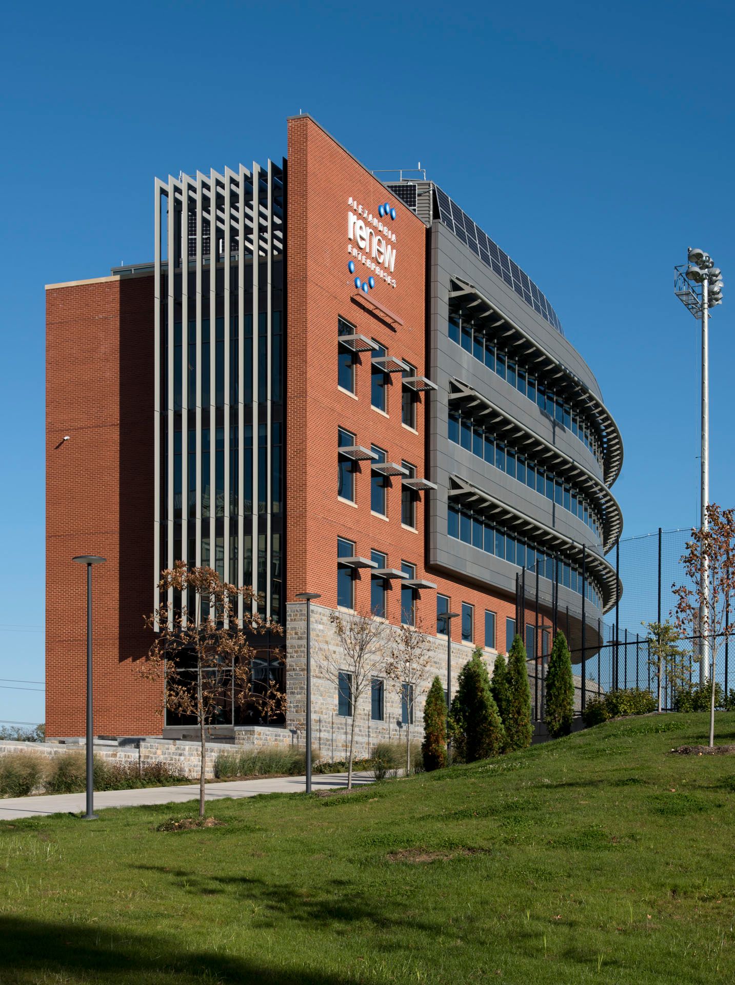 A large brick building with a blue sky in the background