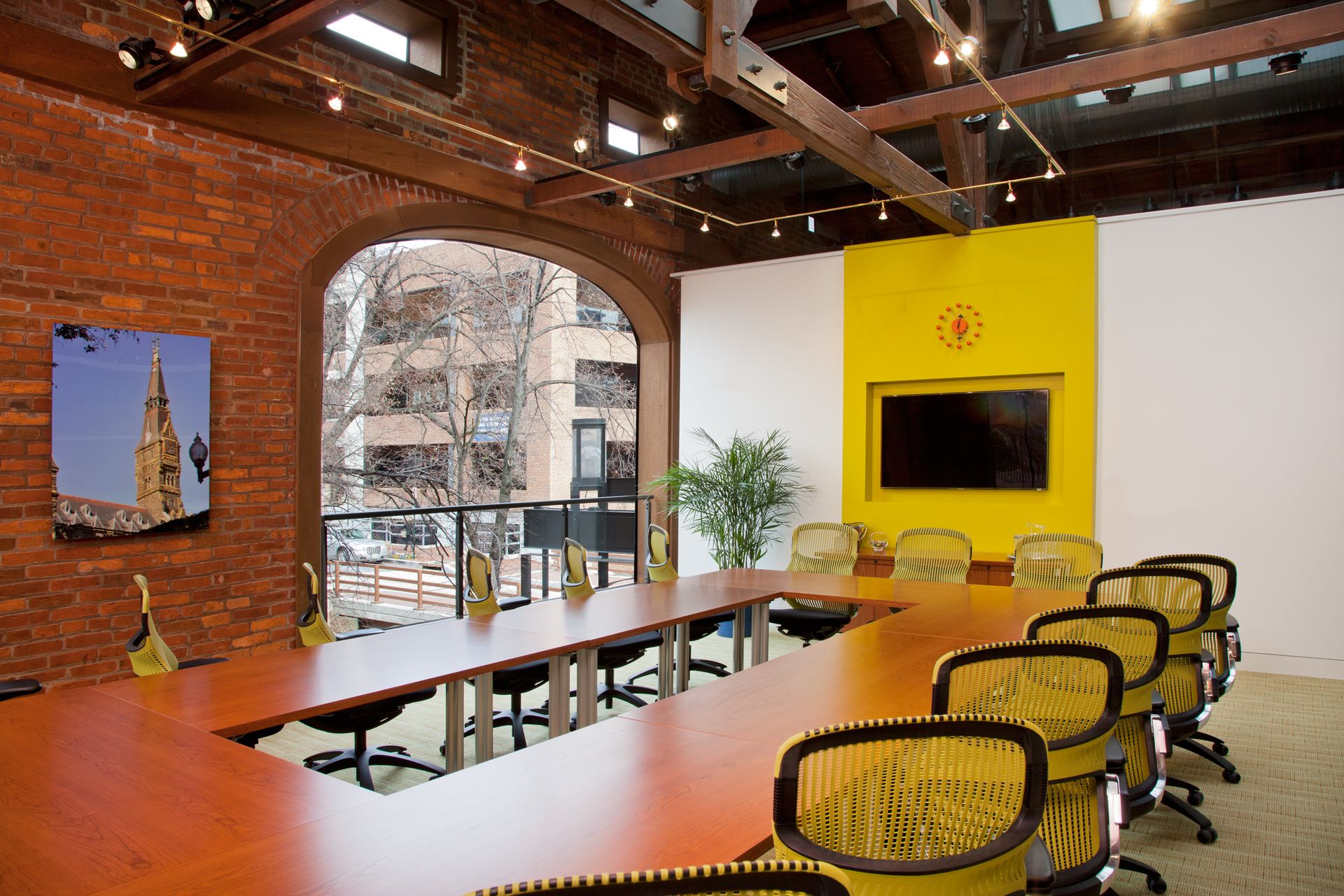 A conference room with a long table and chairs