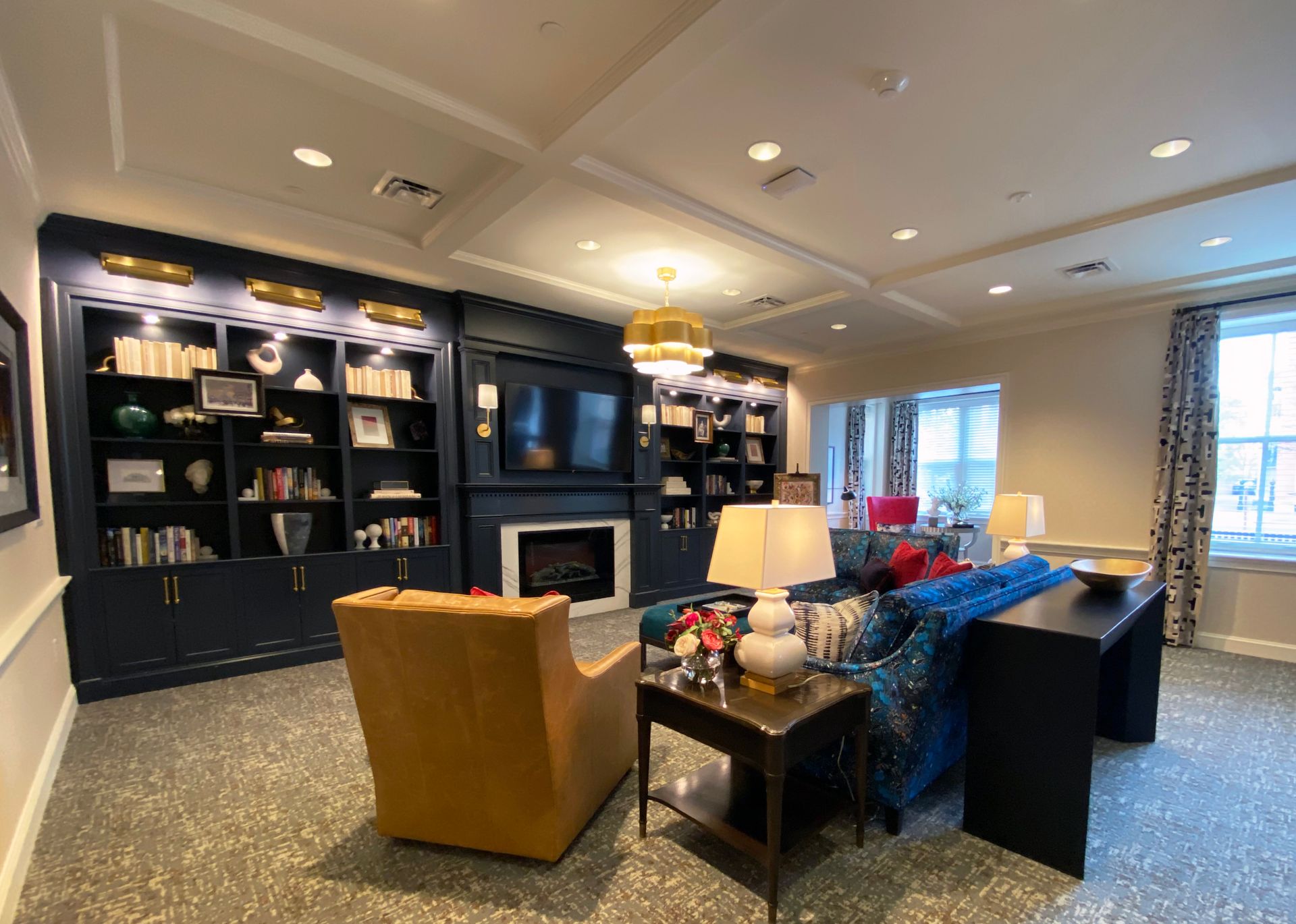 A living room filled with furniture and a fireplace.