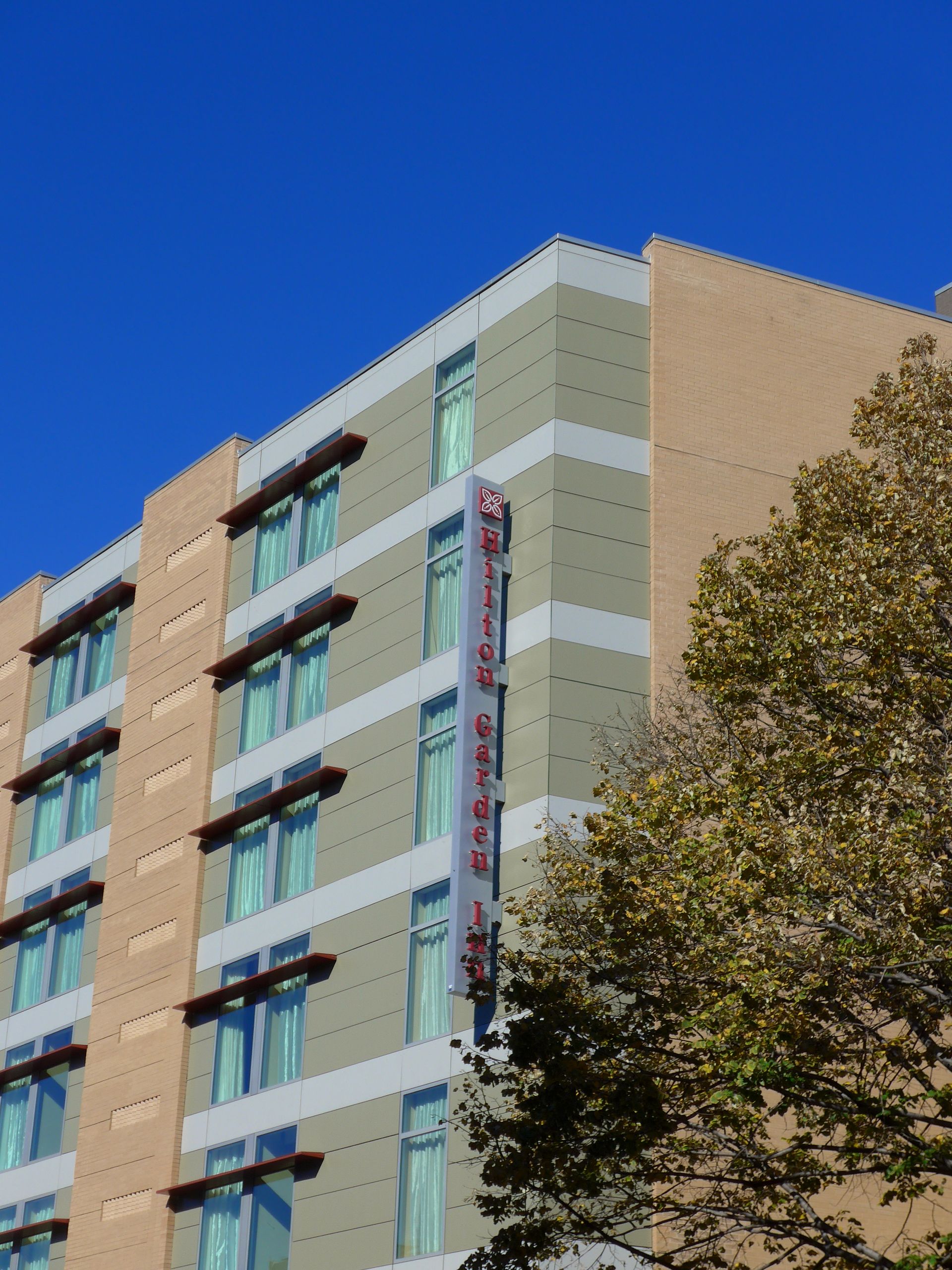A tall building with a sign that says ' hotel ' on it