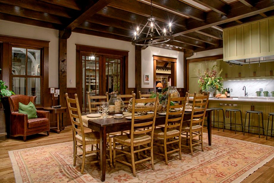 A large dining room with a long table and chairs