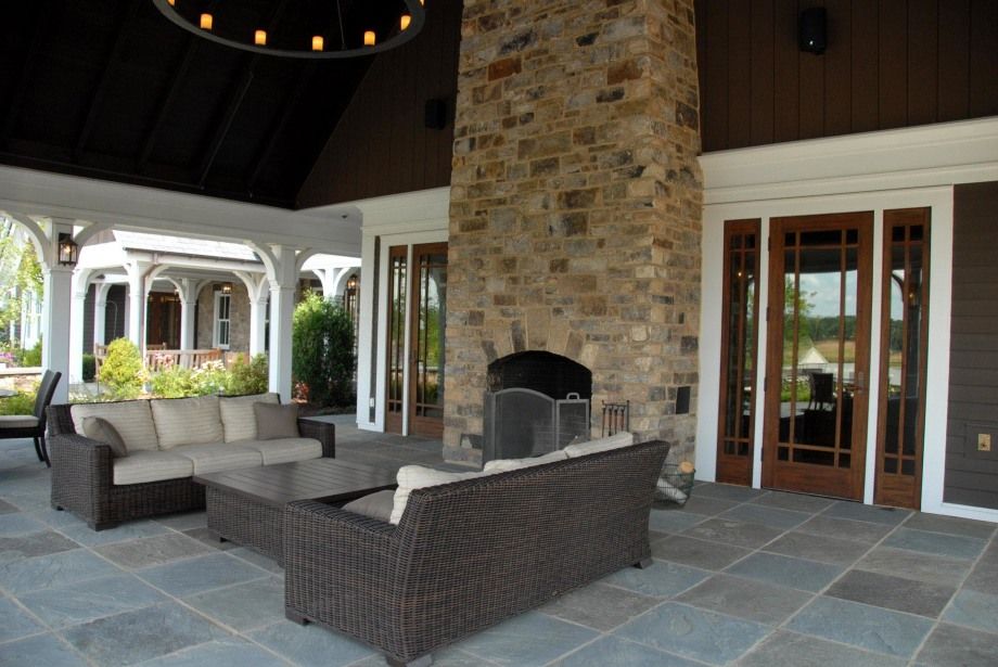 A living room with a fireplace and a couch