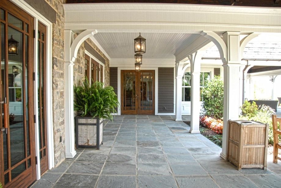 A stone walkway leading to the front door of a house