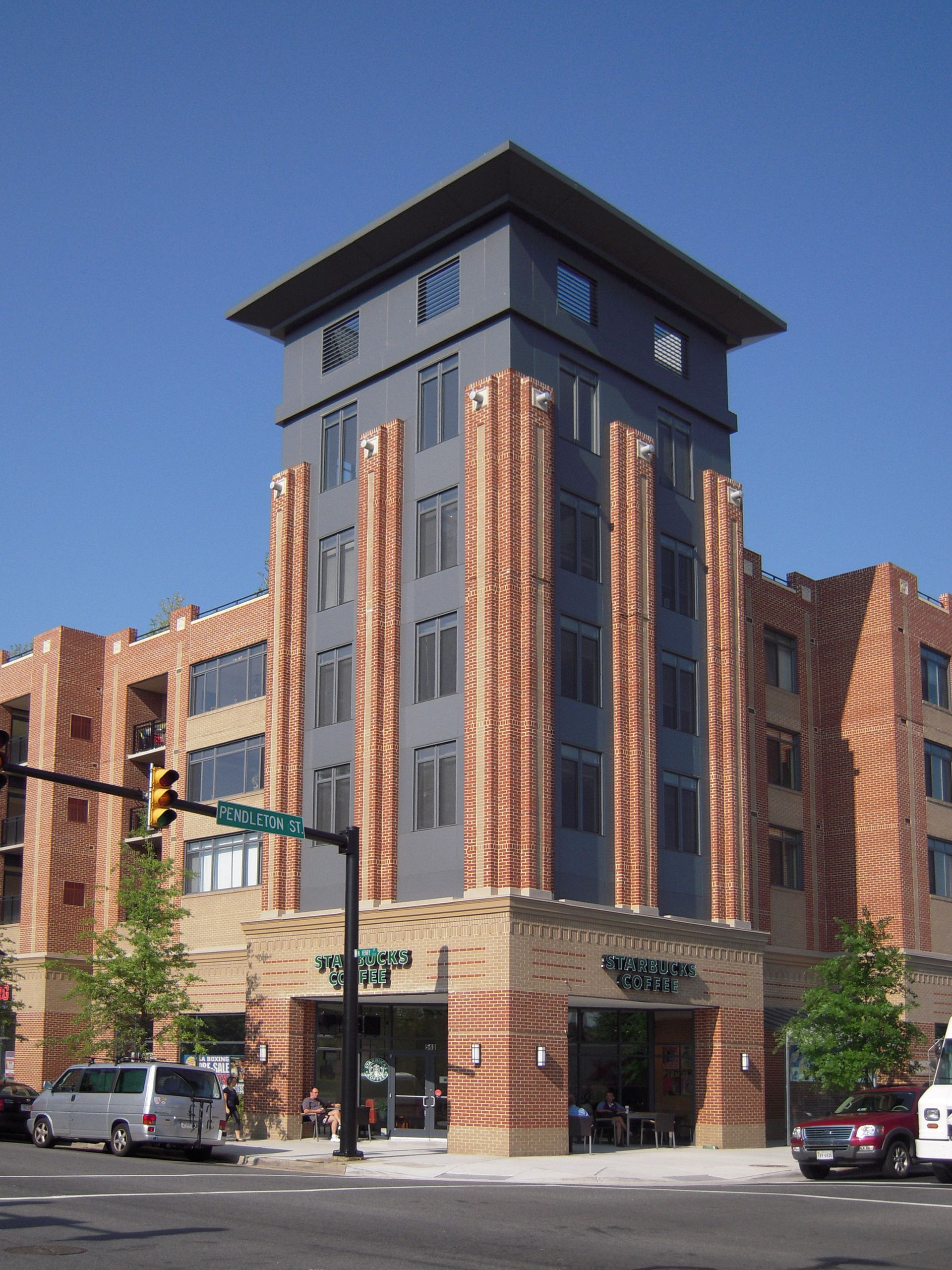A large brick building with a clock on the top of it