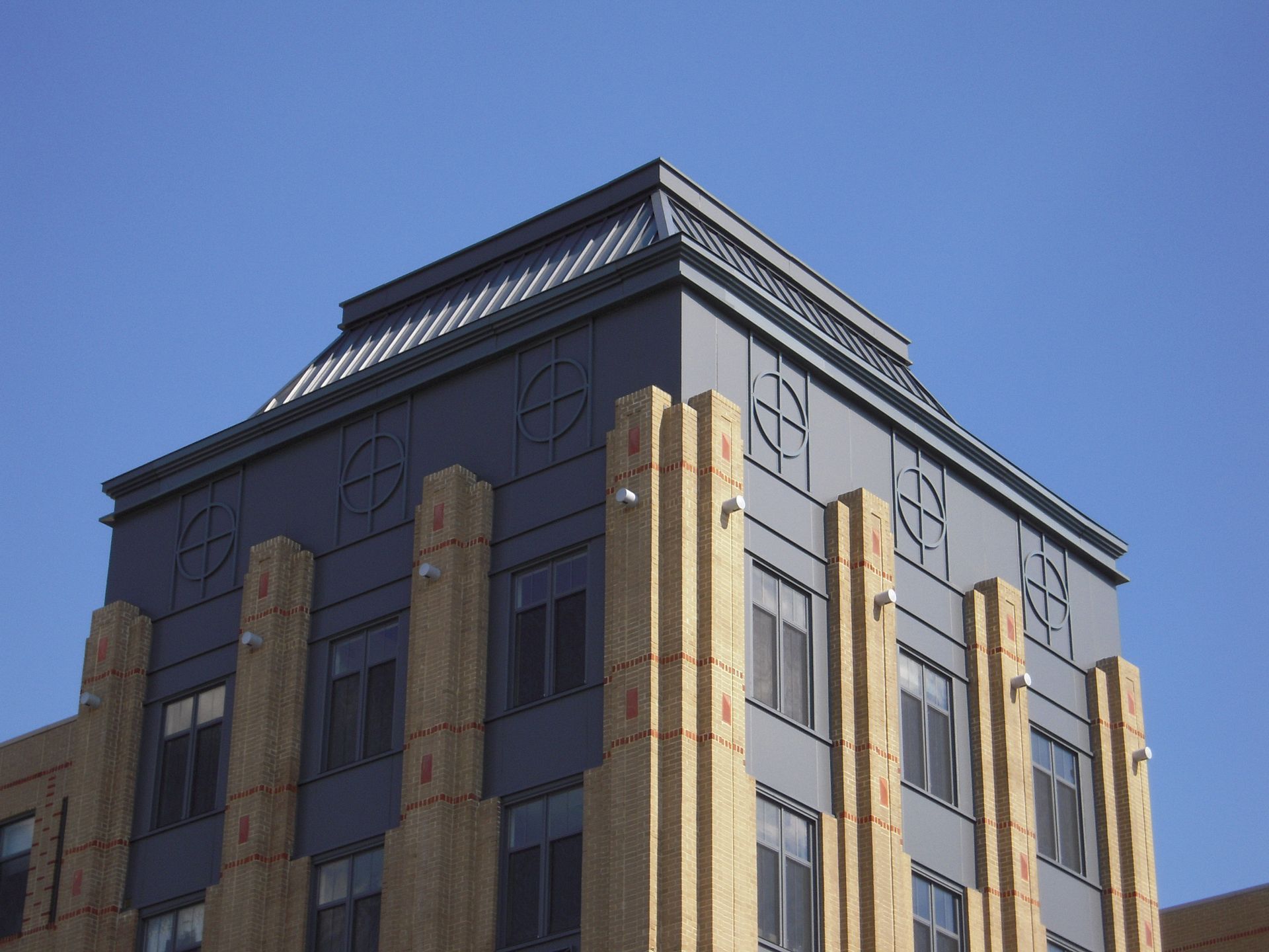 A large building with a blue sky in the background