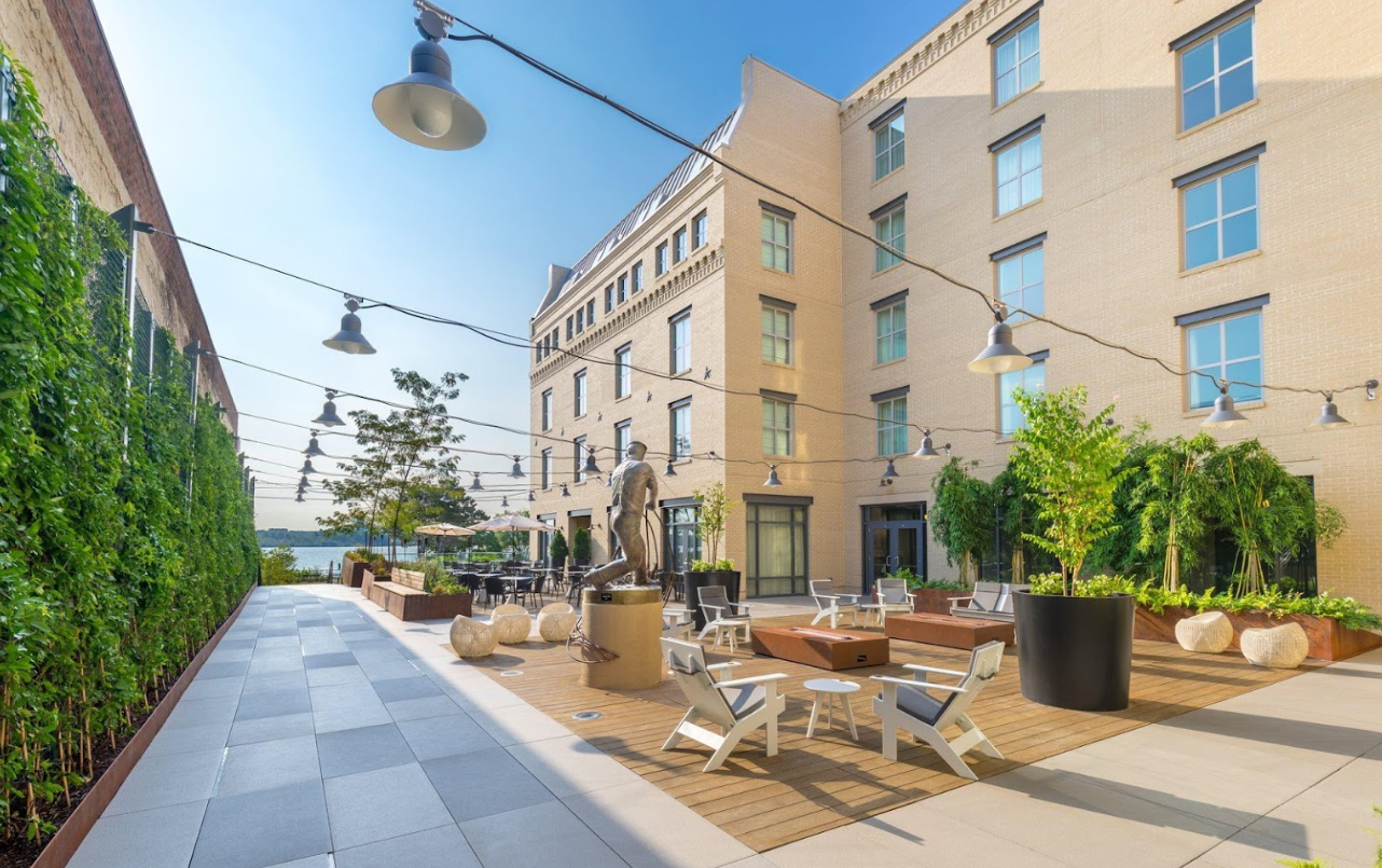 A large building with a patio in front of it.