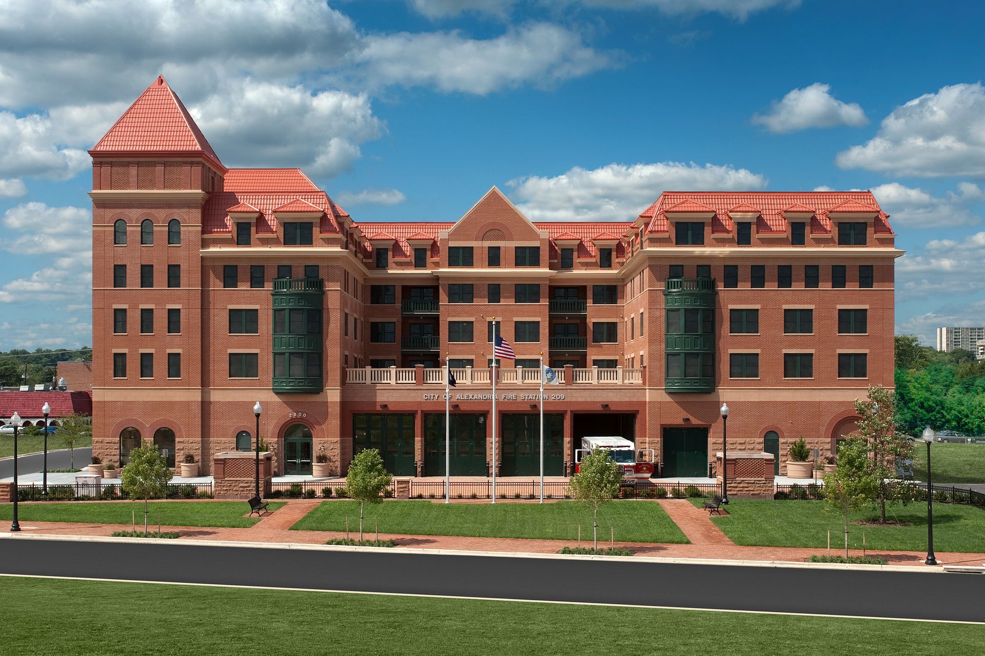 A large brick building with a red tile roof