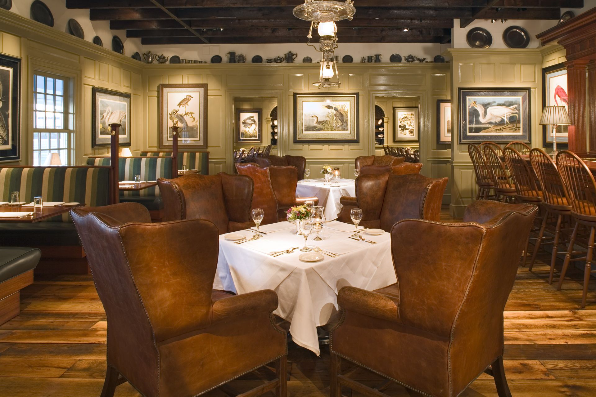 A dining room with a table and chairs in it