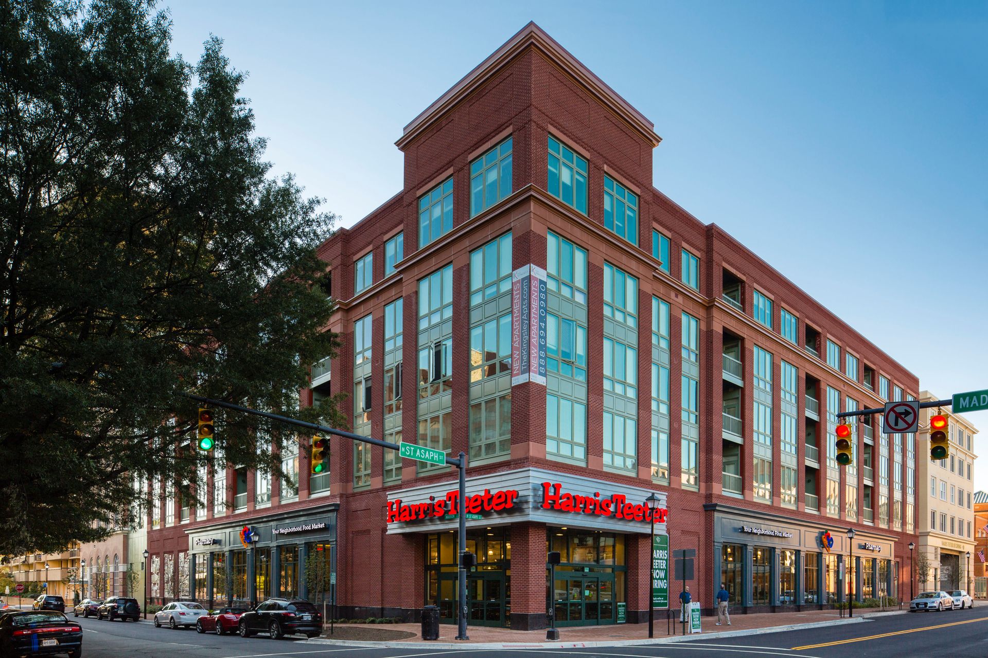 A large brick building with a red sign that says ' marie claire ' on it