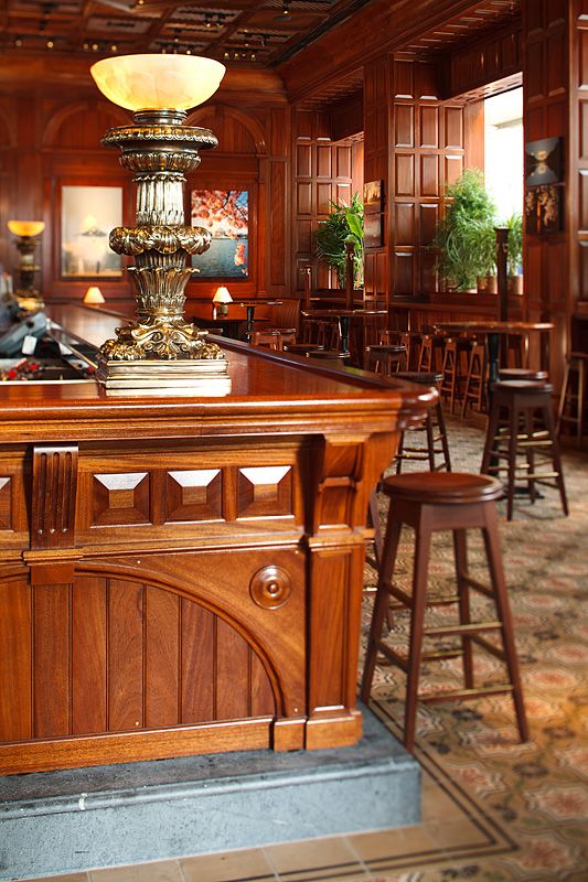 A wooden bar with a lamp on top of it