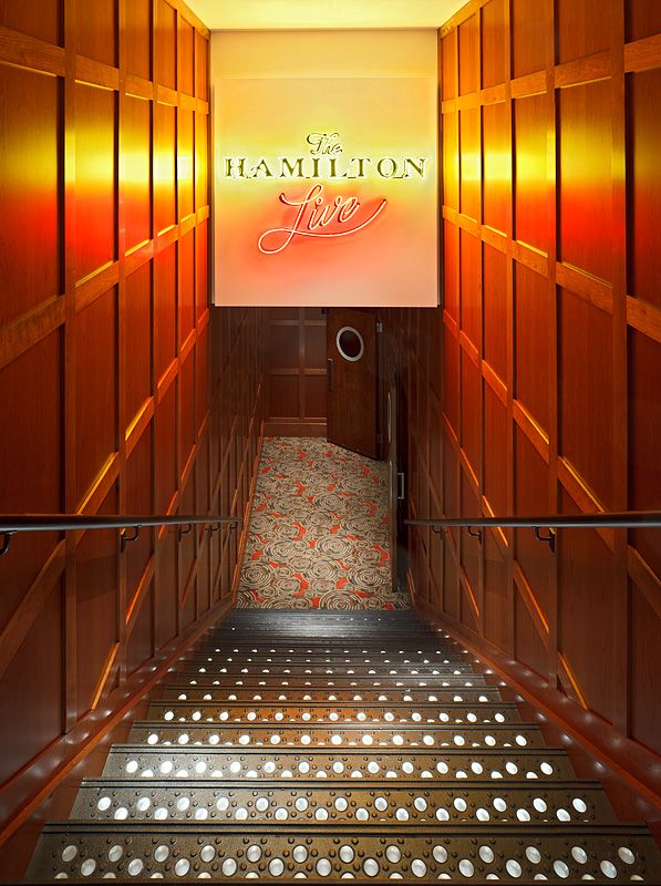 A staircase with a sign that says hamilton on it