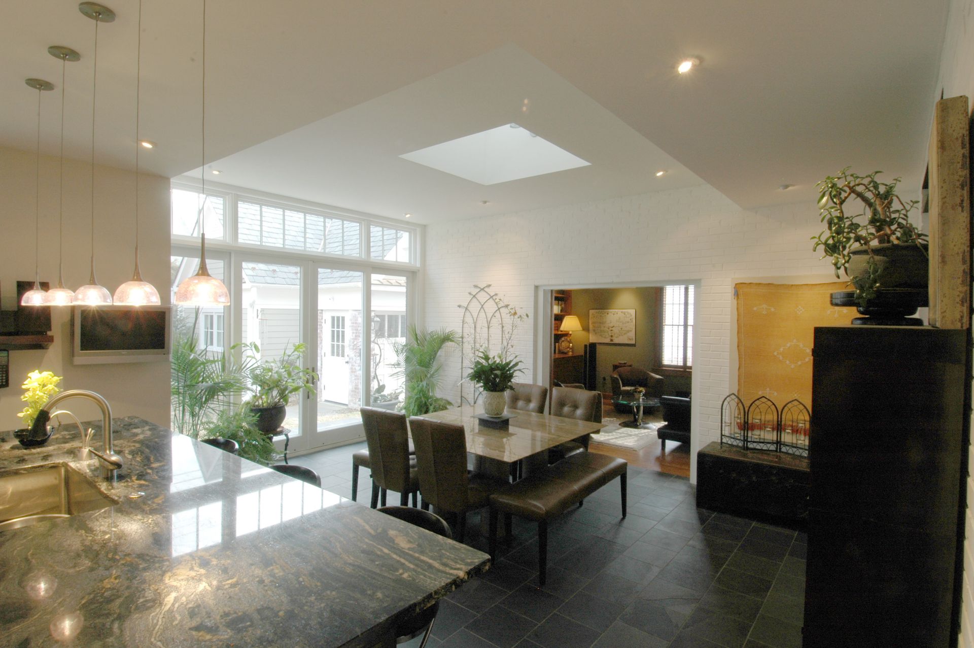 A dining room with a table and chairs in it