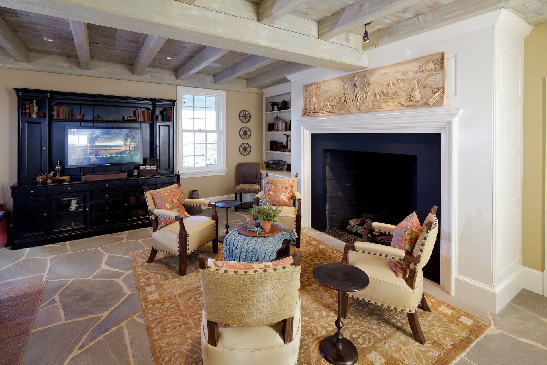 A living room with a fireplace and a flat screen tv