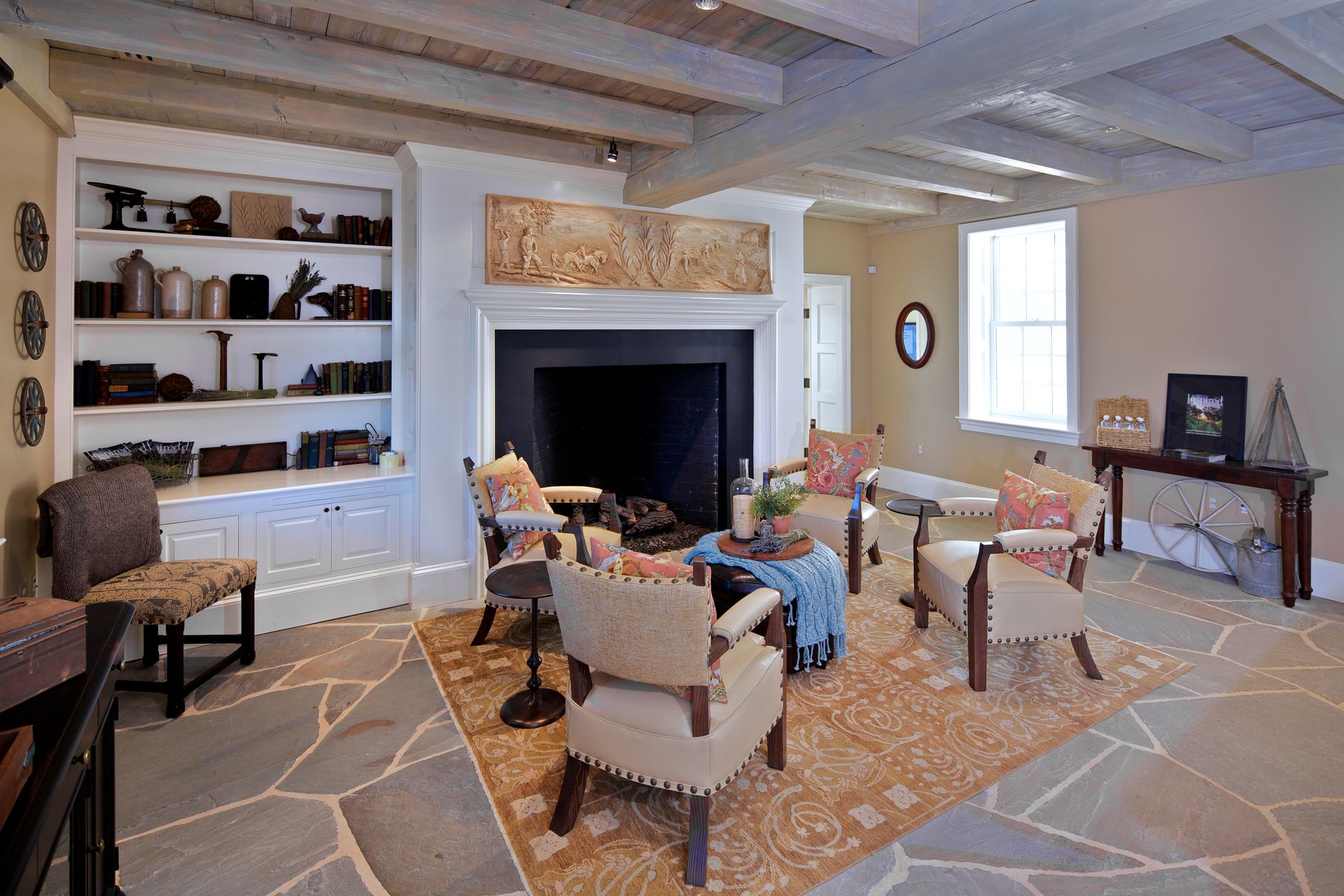 A living room filled with furniture and a fireplace.