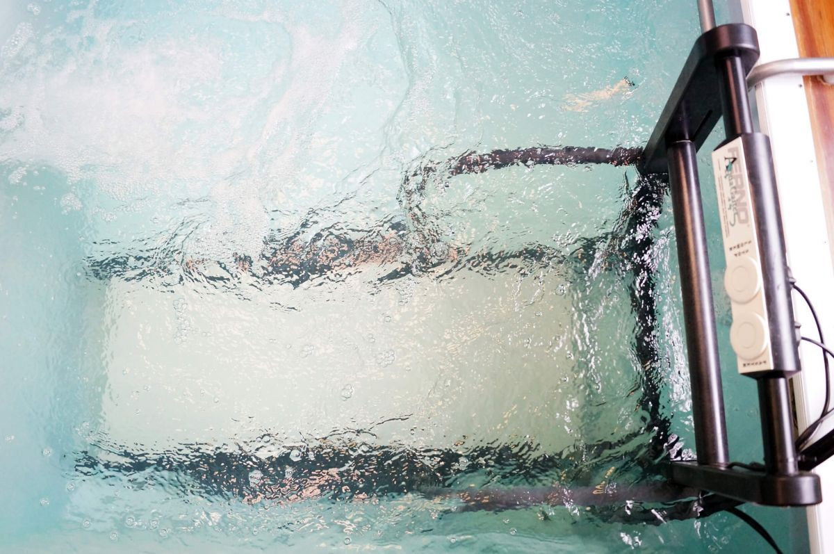 A close up of a swimming pool with water coming out of it.