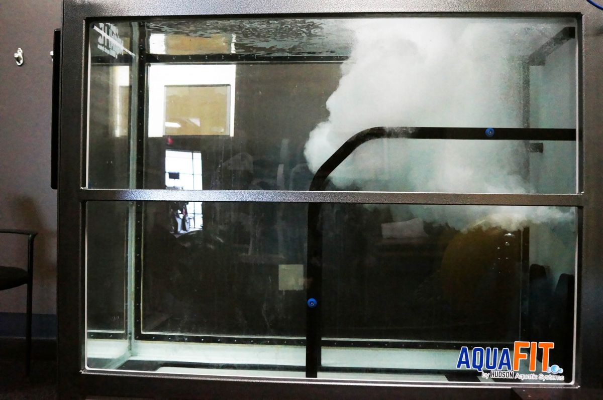 A large aquarium with the word aquafit on it