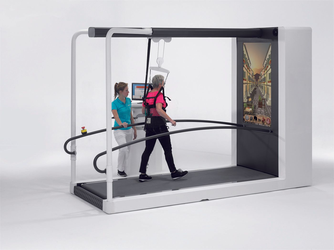 A woman is standing next to a man walking on a treadmill.