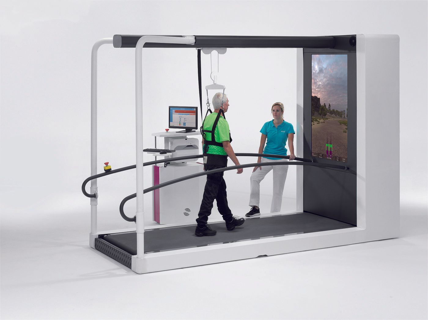 A man is walking on a treadmill with a woman standing next to him.