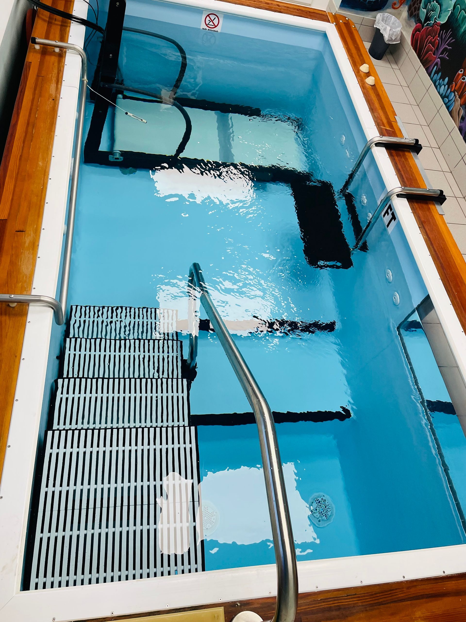 A large swimming pool with stairs leading up to it