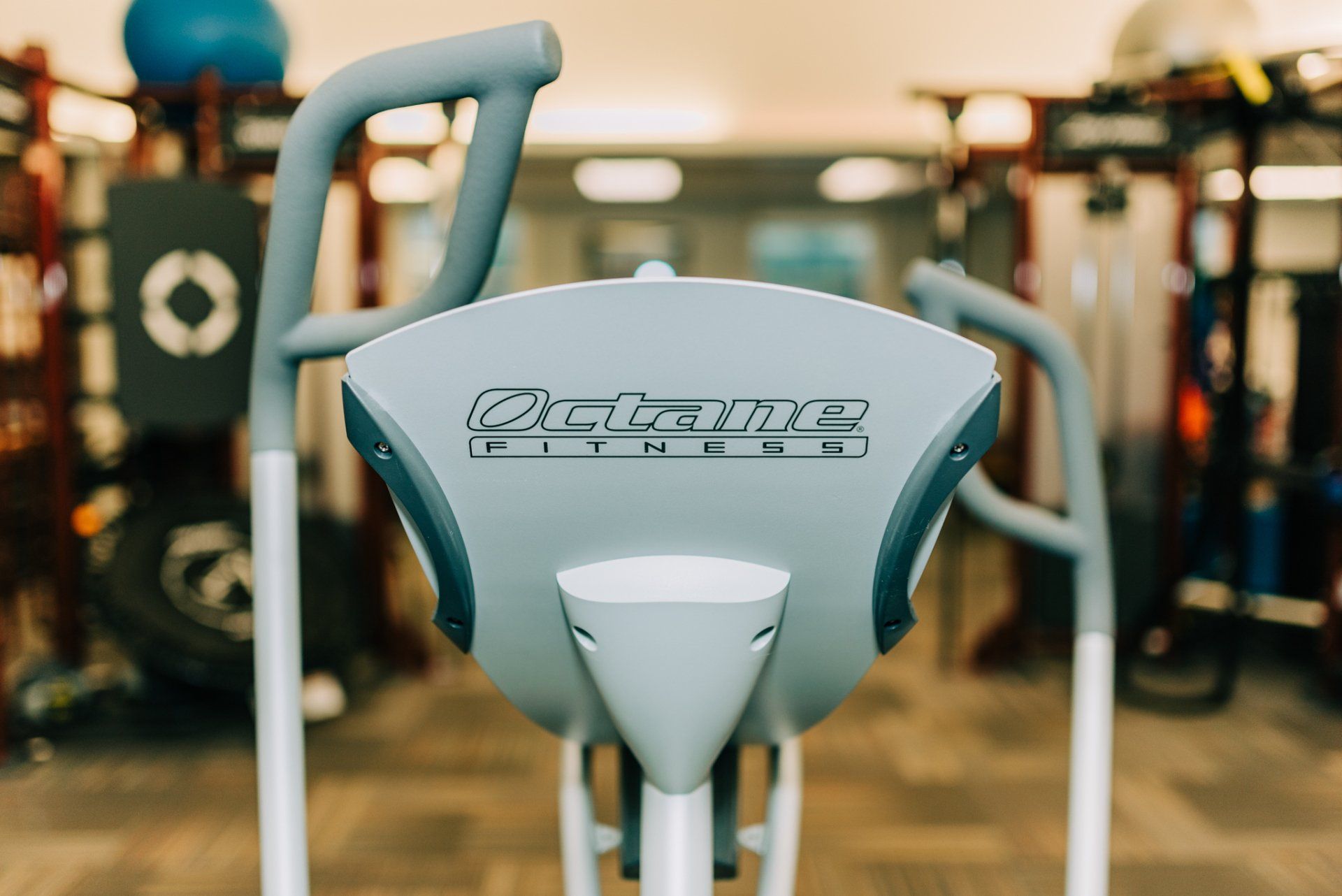 A close up of an elliptical machine in a gym.