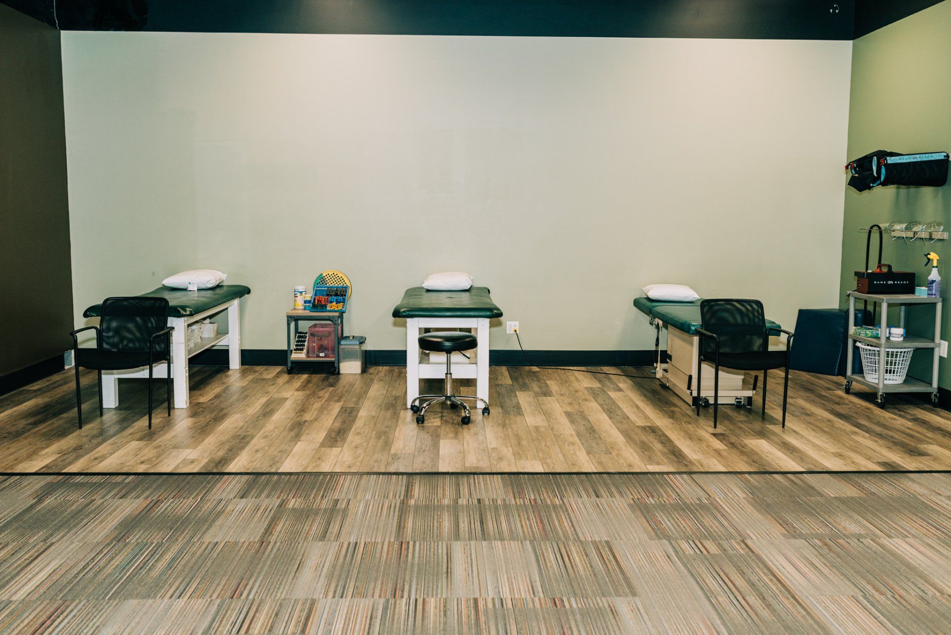 A room with three tables and chairs in it.