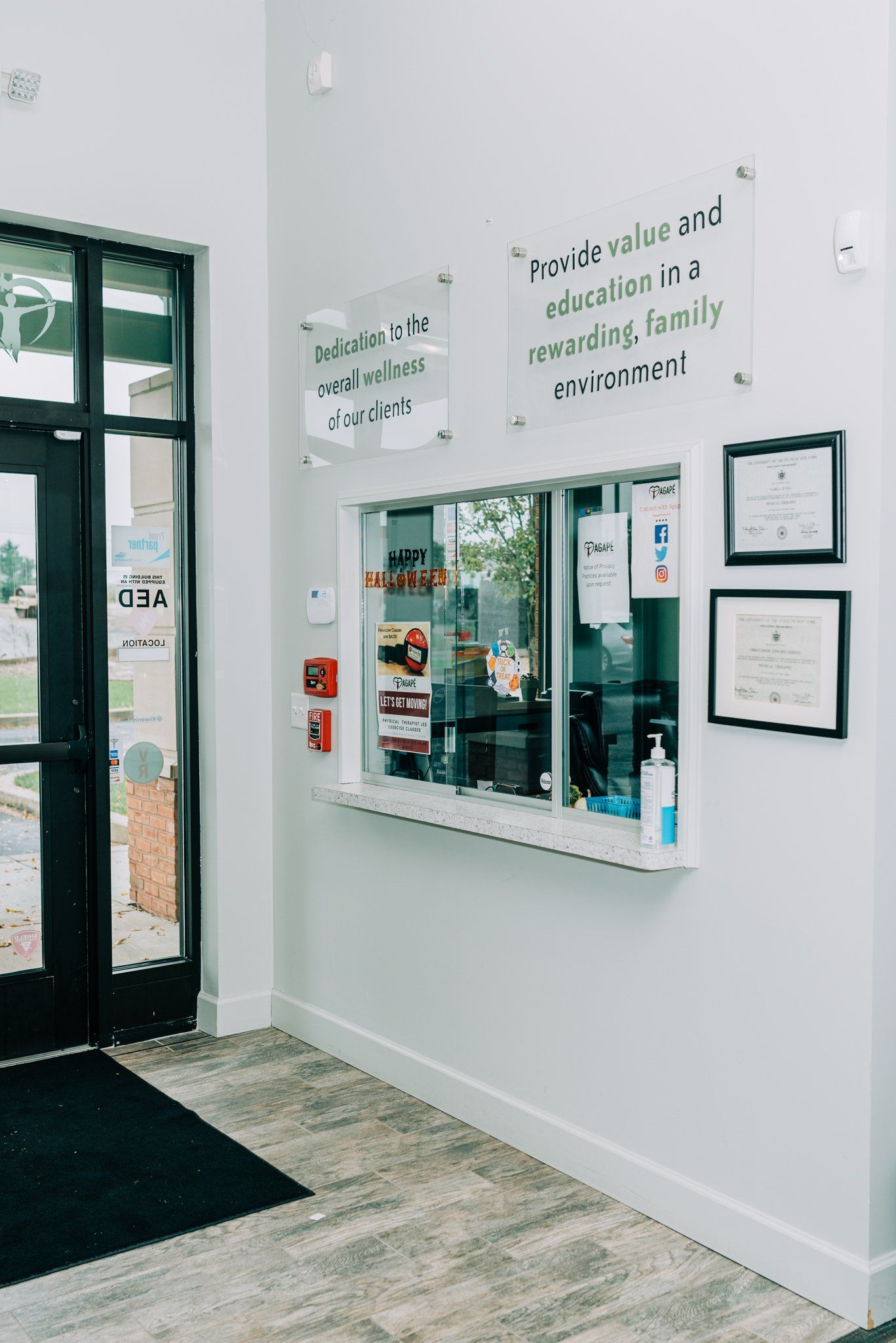 A dental office with a window and a sign on the wall.