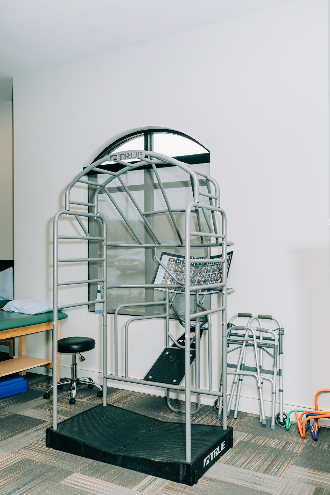 A ladder is sitting on top of a scale in a room.