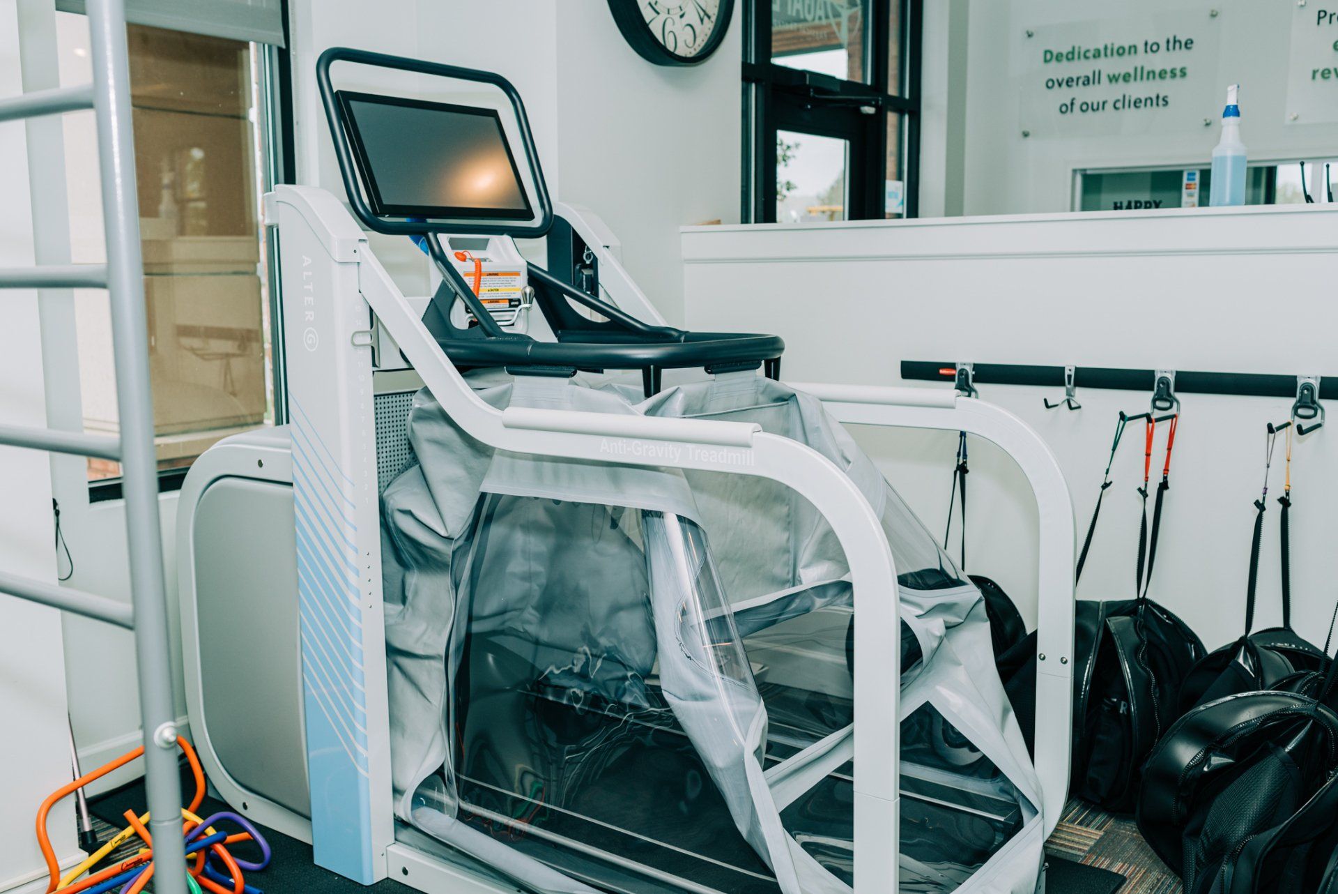A treadmill with a screen on it in a gym.