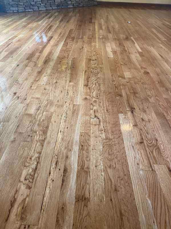 A close up of a wooden floor in a living room.