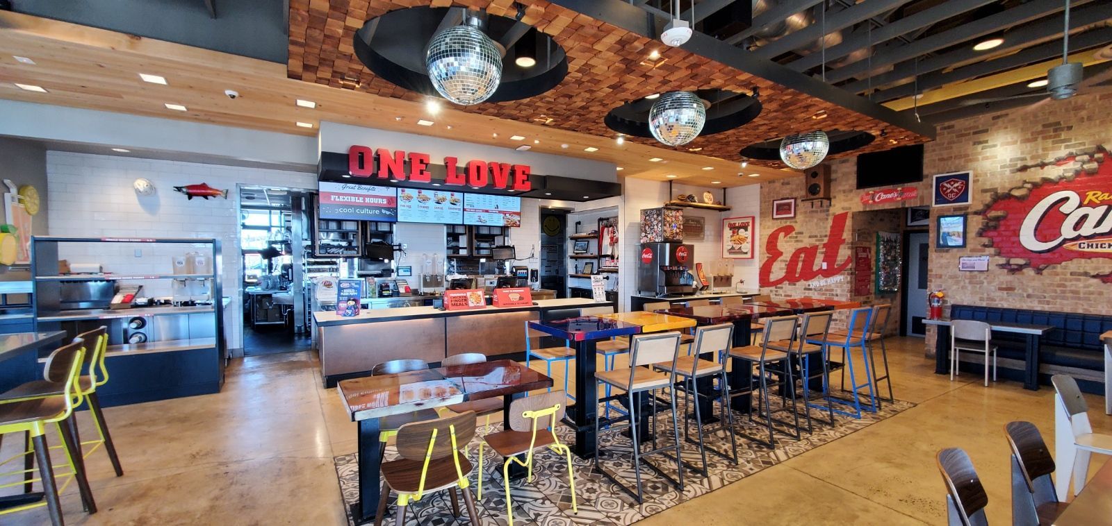 The interior of a Raising Cane's restaurant, featuring a counter with 
