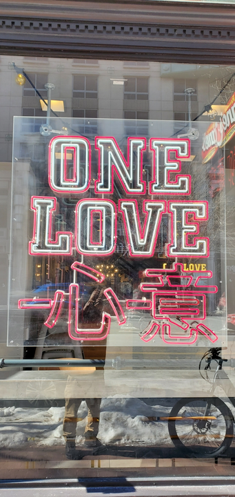 A window decal displays the words 