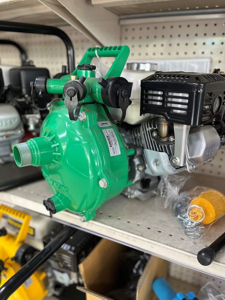Green Water Pump With Black Engine and Handle on Store Shelf — Gloucester Rural Supplies in Bulahdelah, NSW