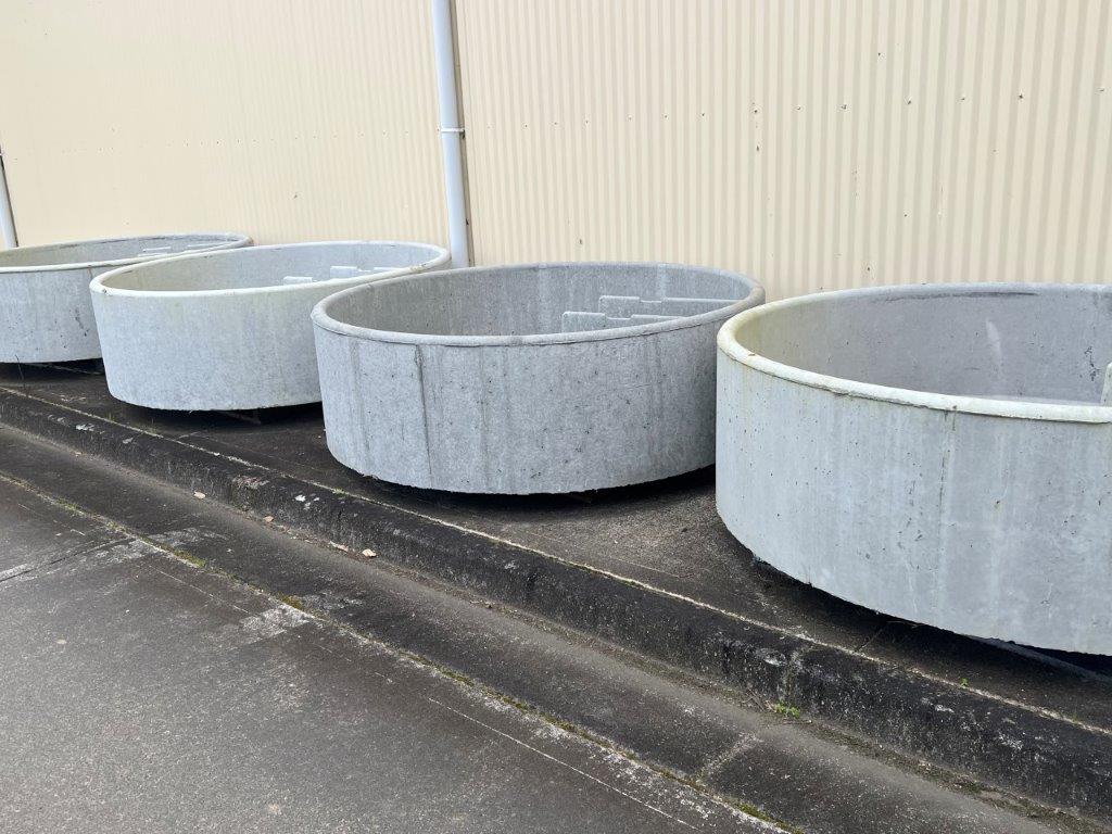 A Row of Concrete Planters Are Sitting on the Side of the Road — Gloucester Rural Supplies in Gloucester, NSW