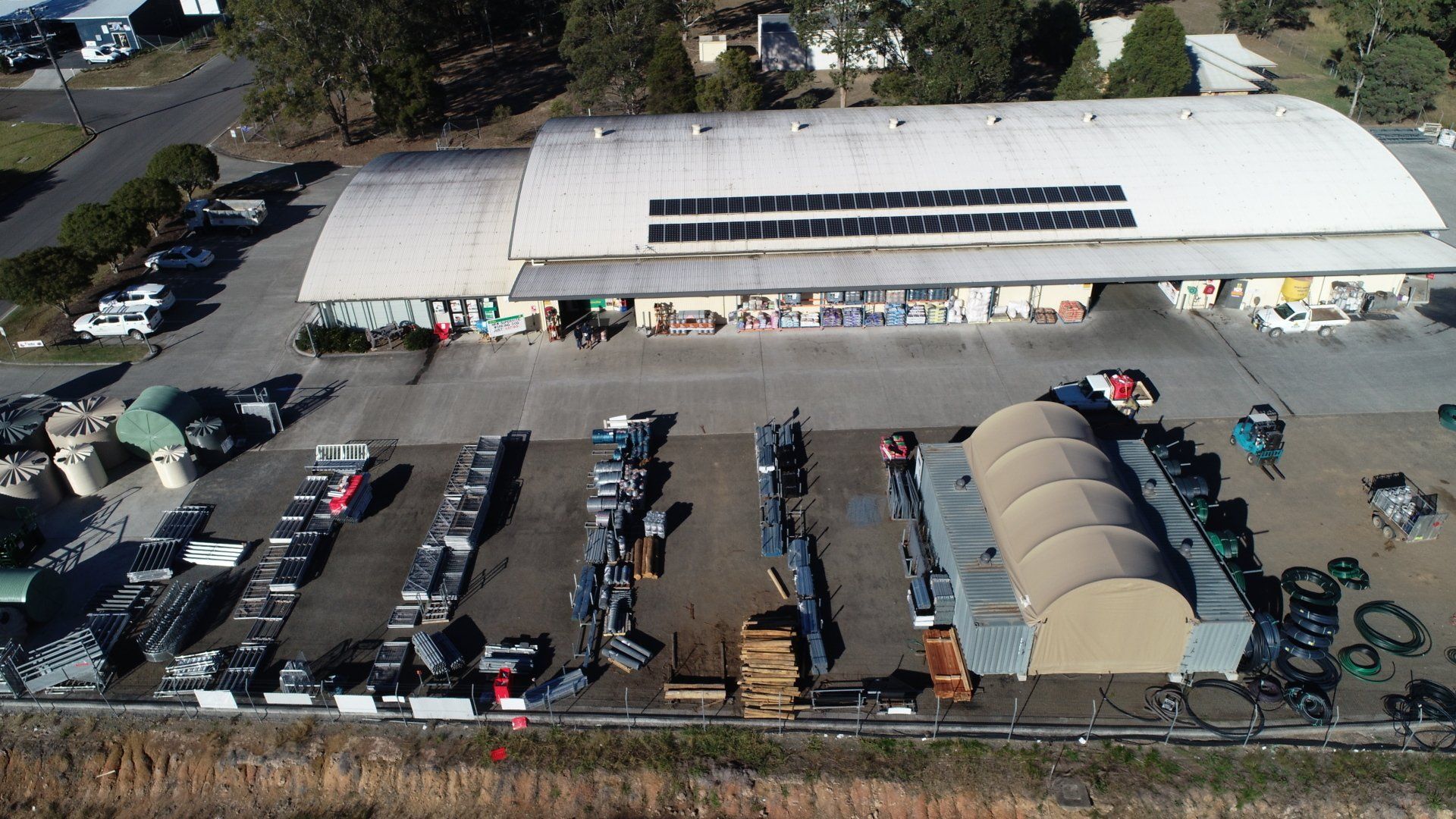 An Aerial View of a Large Building With Solar Panels on the Roof — Gloucester Rural Supplies in Gloucester, NSW