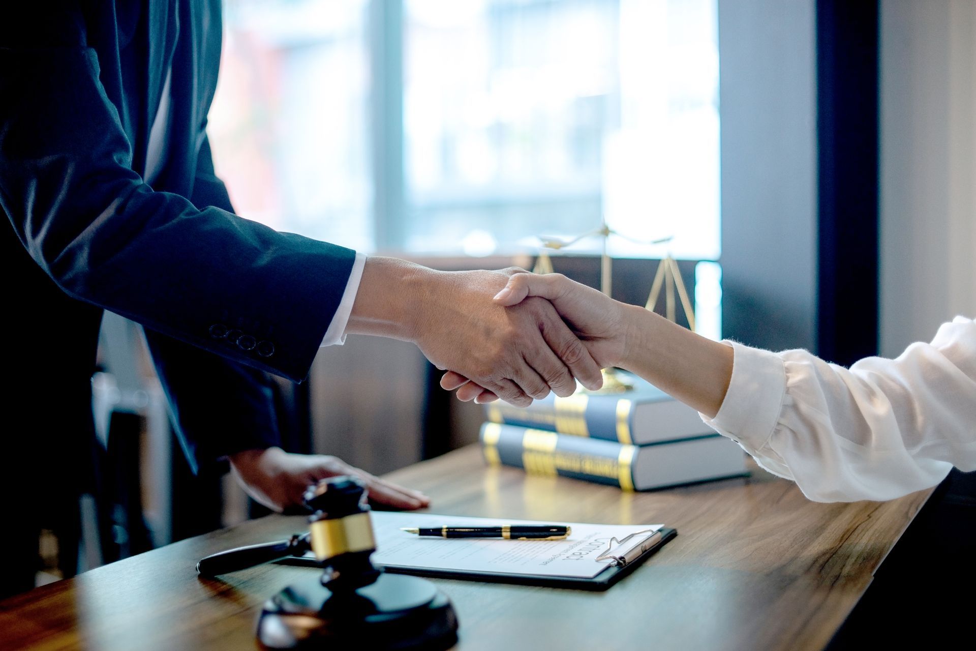 Lawyer or judge with gavel and balance handshake. Lawyer or judge with gavel and balance handshake.