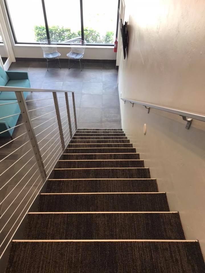 A set of stairs leading up to the second floor of a building.