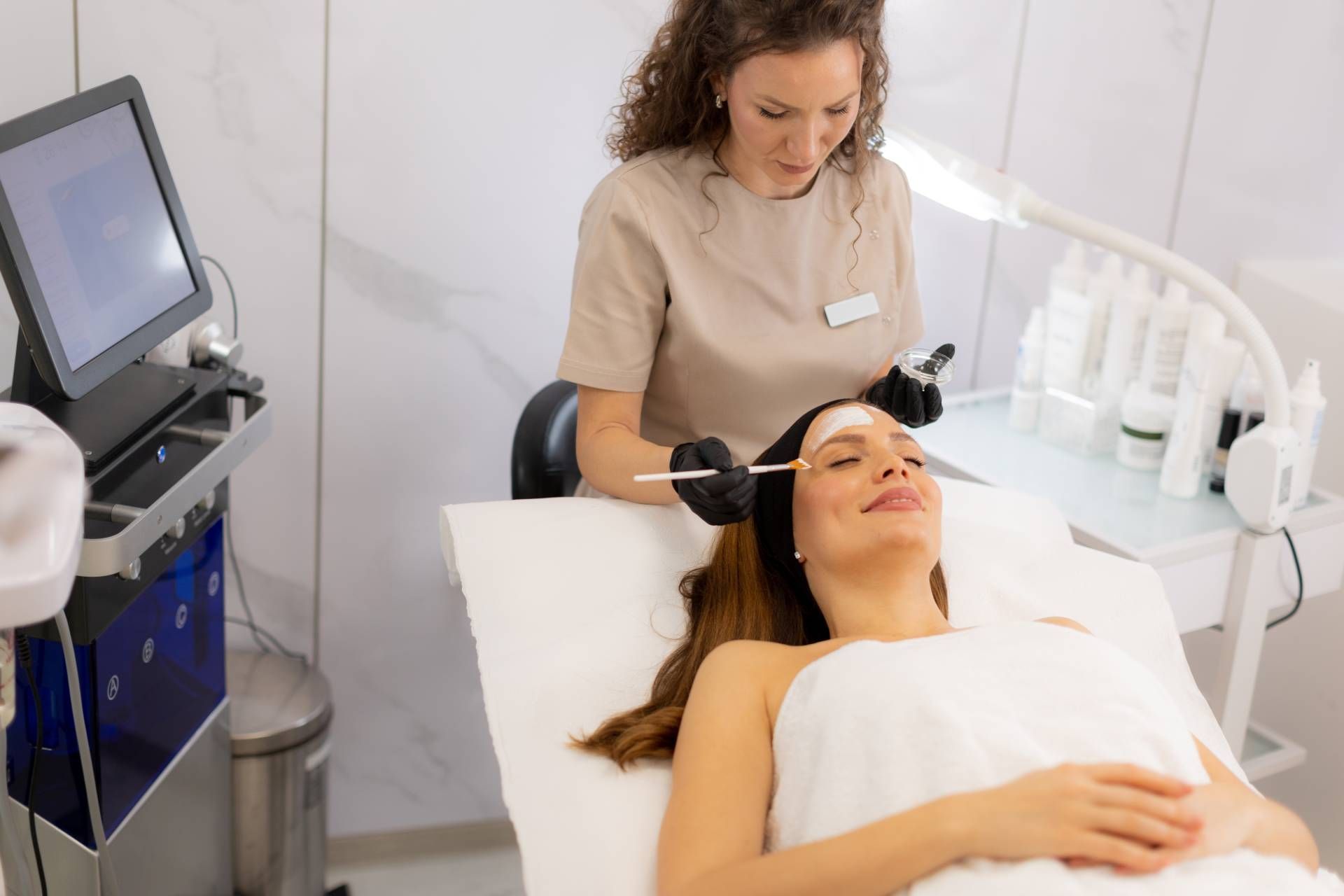 aesthetics provider injecting BOTOX into patient